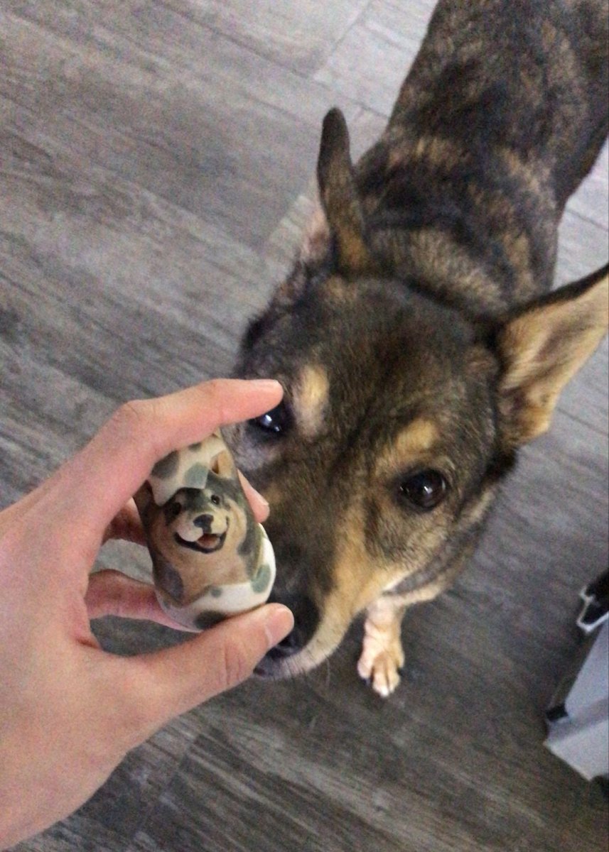 Handmade Easter-themed ceramic dog figurine. Custom pet portrait roly-poly art piece for dog lovers in Singapore. Artisan porcelain sculpture.