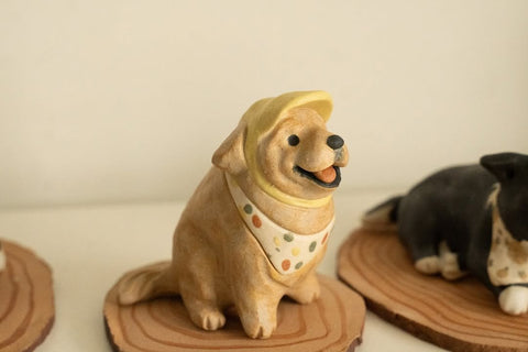 Golden Retriever with yellow bandana and school hat
